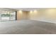 Sunlit carpeted living room with sliding glass doors leading to the outdoor space at 2935 W Kristal Way, Phoenix, AZ 85027