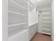 Walk-in closet with custom built-in shelving and ample storage space at 2935 W Kristal Way, Phoenix, AZ 85027