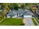 Aerial view of a charming home with a well-maintained yard, pool, and lush landscaping at 3027 W Wescott Dr, Phoenix, AZ 85027
