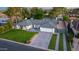 Aerial view of single-story home with a large yard, block fence, gated driveway and private backyard pool at 3027 W Wescott Dr, Phoenix, AZ 85027