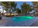 Lush backyard features a sparkling pool, mature trees, and comfortable lounge furniture for outdoor enjoyment at 3027 W Wescott Dr, Phoenix, AZ 85027