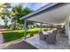Covered patio features an outdoor dining area overlooking the backyard and pool at 3027 W Wescott Dr, Phoenix, AZ 85027