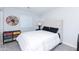 Bedroom with neutral tones, tufted headboard, and playful decor at 3027 W Wescott Dr, Phoenix, AZ 85027