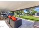 Covered patio with comfortable seating, overlooking the backyard, pool, and landscaping for outdoor relaxation at 3027 W Wescott Dr, Phoenix, AZ 85027