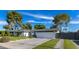 Beautiful single-story home featuring a lush lawn, desert landscaping, and a private gated entrance at 3027 W Wescott Dr, Phoenix, AZ 85027