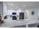 Bright kitchen featuring white cabinetry, stainless steel appliances, and a stone-look countertop at 3027 W Wescott Dr, Phoenix, AZ 85027
