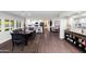 Open living space with a dining area and kitchen with tile floors and natural light at 3027 W Wescott Dr, Phoenix, AZ 85027