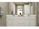 Bright bathroom with double vanity, white cabinetry, ample counter space, and modern fixtures at 3238 E Outlaw Ln, San Tan Valley, AZ 85140