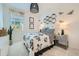 Charming bedroom with black and white floral bedding and honeycomb wall decor at 3272 E Ranchhand Dr, San Tan Valley, AZ 85140