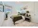 Bright bedroom with an olive green bed set, neutral walls, and light-colored carpet at 3272 E Ranchhand Dr, San Tan Valley, AZ 85140