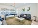 Cozy living room with a pool table, comfortable sofa, and stylish decor, perfect for entertaining at 3272 E Ranchhand Dr, San Tan Valley, AZ 85140