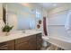 Well-lit bathroom featuring a vanity, and a shower-tub combo at 3330 S Lotus Ave, Mesa, AZ 85212
