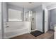 Well-lit bathroom features a separate shower and tub, offering a versatile and relaxing space at 3432 E Bartlett Dr, Gilbert, AZ 85234