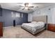Comfortable bedroom featuring a cozy bed, ceiling fan, and neutral decor, a restful retreat at 3432 E Bartlett Dr, Gilbert, AZ 85234