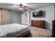 Spacious bedroom featuring a TV, ceiling fan, and neutral decor, offering a great space to relax at 3432 E Bartlett Dr, Gilbert, AZ 85234