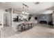 Open floor plan with a bright kitchen island with seating and great view of the surrounding living spaces at 3432 E Bartlett Dr, Gilbert, AZ 85234