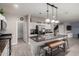 Bright, open kitchen with island seating, stainless appliances, and seamless flow to adjacent living spaces at 3432 E Bartlett Dr, Gilbert, AZ 85234