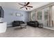 Inviting living room with comfortable seating, natural light, ceiling fan and a decorative color scheme at 3432 E Bartlett Dr, Gilbert, AZ 85234