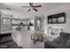 Open-concept living room and kitchen with tile flooring, and a spacious layout, perfect for entertaining at 3432 E Bartlett Dr, Gilbert, AZ 85234