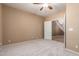 Bedroom with neutral carpeting and a door leading to the hallway at 346 W Oxford Ln, Gilbert, AZ 85233