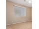 Neutral carpeted bedroom featuring a ceiling fan and natural light through window blinds at 346 W Oxford Ln, Gilbert, AZ 85233