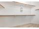 Walk-in closet featuring ample storage space with shelving and hanging rods at 346 W Oxford Ln, Gilbert, AZ 85233