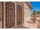 Close-up of courtyard featuring ornate doors and a charming water fountain, adding to the home's appeal at 346 W Oxford Ln, Gilbert, AZ 85233