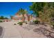 Lovely single-Gathering home featuring a three-car garage, desert landscaping and a charming courtyard fountain at 346 W Oxford Ln, Gilbert, AZ 85233