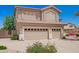 This home showcases a three-car garage with updated doors, neutral paint and a low-maintenance yard at 346 W Oxford Ln, Gilbert, AZ 85233