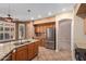 Bright kitchen with oak cabinets, granite countertops, stainless steel appliances, and an island sink at 346 W Oxford Ln, Gilbert, AZ 85233