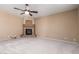 Cozy living room with plush carpeting, recessed lighting, and a charming fireplace adding warmth at 346 W Oxford Ln, Gilbert, AZ 85233