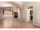 Spacious living room featuring tile floors, ceiling fan and an open floor plan with archways at 346 W Oxford Ln, Gilbert, AZ 85233