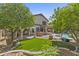 Lush backyard featuring a pool, patio, and manicured landscaping at 3478 E Park Ave, Gilbert, AZ 85234