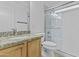 Bathroom featuring a granite countertop vanity, updated fixtures, and a glass-enclosed shower at 3478 E Park Ave, Gilbert, AZ 85234