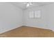 Bright bedroom with a ceiling fan, wood floor, and natural light at 3478 E Park Ave, Gilbert, AZ 85234