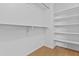 Walk-in closet with built-in shelves and rod at 3478 E Park Ave, Gilbert, AZ 85234