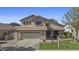 Charming home showcasing a well-kept lawn, neutral stucco facade, and convenient attached two-car garage at 3478 E Park Ave, Gilbert, AZ 85234