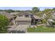 Two-story home featuring a neutral color scheme, well-maintained lawn, and an attached two-car garage at 3478 E Park Ave, Gilbert, AZ 85234