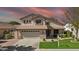Charming two-story home featuring a well-manicured lawn, a two-car garage, and a welcoming facade at 3478 E Park Ave, Gilbert, AZ 85234
