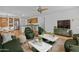 Spacious living room with wood floors and furniture, with views to the kitchen at 3478 E Park Ave, Gilbert, AZ 85234