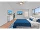 Staged main bedroom featuring new furniture, flooring and ceiling fan at 3478 E Park Ave, Gilbert, AZ 85234