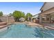 Inviting pool with clear water, surrounded by a patio and mature trees at 3478 E Park Ave, Gilbert, AZ 85234