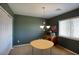 Dining room featuring a round table, chandelier, and natural light from a window at 3649 E Hutchins Ct, Gilbert, AZ 85295