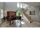 Bright foyer featuring wood-look tile floors, tall ceilings, and a staircase at 3649 E Hutchins Ct, Gilbert, AZ 85295