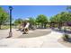 Playground with slides and covered picnic area, offering a delightful space for children and families to gather and play at 3649 E Hutchins Ct, Gilbert, AZ 85295