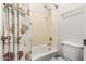 Bright bathroom featuring seashell curtain, tub and shower, and a toilet at 3810 S Star Canyon Dr, Gilbert, AZ 85297
