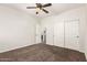 Neutral bedroom with a ceiling fan, carpet flooring, and double door closet at 3810 S Star Canyon Dr, Gilbert, AZ 85297