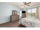 Bright, airy bedroom with large window, ceiling fan, and coordinating furniture at 3810 S Star Canyon Dr, Gilbert, AZ 85297