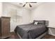 Comfortable bedroom with plush bedding, carpet, and a large window at 3810 S Star Canyon Dr, Gilbert, AZ 85297