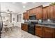 Eat-in kitchen boasts wooden cabinets, granite counters, stainless appliances, and plenty of natural light at 3810 S Star Canyon Dr, Gilbert, AZ 85297